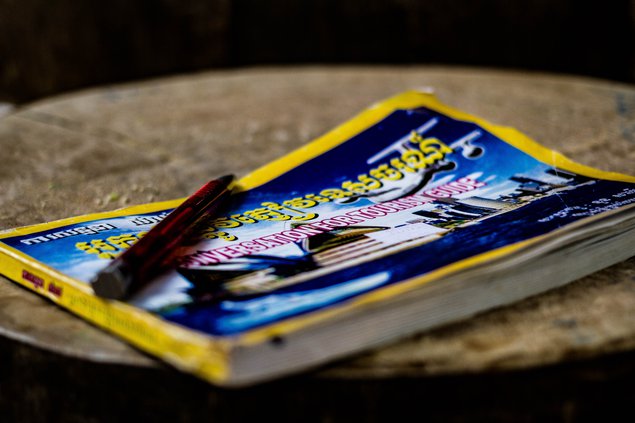 An English guidebook on a wooden carving board